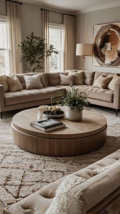 a living room filled with furniture and a large window covered in curtains next to a rug