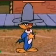 a cartoon character wearing a hat and holding a star in front of a baseball field