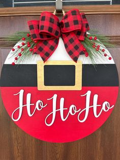 a red and black christmas door hanger with the word ho hoo on it