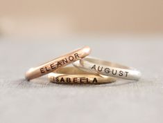 Simple name stacking rings. Made with .925 sterling silver, 14K gold filled, or 14K rose gold filled. Listing is for one ring Symbols available for engraving: 🖤 o * ∞ 🐾 ↢ ↣ ♫ The band is 2.59mm wide. Please message me if you would like a different font. These rings are made of high quality materials. The colors will not chip off or fade and can be worn in water. This ring is made to order in your size. If you don't see your size available please feel free to message me. All orders ship in a gi Gold Name Ring, Rings Sterling Silver, Name Ring, Engraved Ring, Name Rings, Personalized Ring, Personalized Rings, One Ring, Engraved Rings