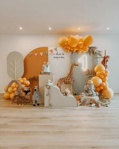 a room filled with lots of balloons and stuffed animals on the floor next to a wall