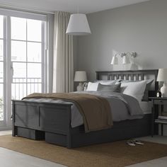 HEMNES bed frame with 4 storage boxes, dark gray stained/Lyngör white, Queen. HEMNES bed frame is a timeless beauty in solid wood with storage drawers that keep things close by – and LYNGÖR mattress base gives extra height and helps your mattress keep its shape for longer. Leg/ Headboard/ Bedside/ Top rail/ Middle rail: Solid pine. Bedroom Black Bed Frame, Black Wood Bed Frame, Warming Blanket, Ikea Hemnes Bed, Black Beds, Hemnes Bed, Bed Frame Legs, Headboard Bedroom, Black Bed Frame