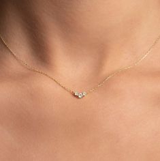 "✦ Three Diamond Necklace ✦  Specifications ------------------------------------------ 📅 Made to order, 3-5 business days 🛫 Free Fast Shipping * Metal:  14k Yellow Gold / 14k White Gold / 14k Rose Gold * Chain width:  1.00mm * Chain length:  14-16\", 16-18\", 18-20\" * Outer diameter:  4.74mm X 10.40mm pendant * Diamonds:  2 X 2.00mm (0.06ct), 1 X 3.00mm (0.11ct) * Shape:  Round * Setting:  Prong set * Color:  D-F * Clarity:  SI1+ * Dimensions: 1.10mm  * Carat weight:  0.17ct * Closure:  Spring clasp closure / Lobster available upon request ✧ MATERIALS - Ethically Sourced Diamonds Diamonds are one of the hardest natural materials on the planet. Our high-quality diamonds (SI 1-2 clarity) are sourced ethically from suppliers who commit to conflict-free and socially responsible practices. W Delicate Diamond Necklace, Dainty Diamond Necklace, Gold Armband, Moissanite Necklace, Rose Gold Chain, Solid Gold Jewelry, Delicate Necklace, Dainty Necklace, Sparkle Diamonds