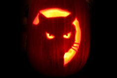 a pumpkin carved to look like a cat