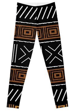 a pair of black and brown patterned leggings with white lines on the side