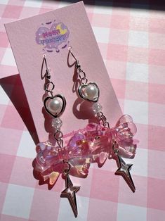 Adorable bow dangle earrings  🎀 Features stainless steel hooks, faux pearls and heart charms ⸜(｡ ˃ ᵕ ˂ )⸝♡ 🎀 3" drop length 🎀 Stainless steel hooks 🎀 Follow @moonfactorydeco on ig for updates and new releases! 🎀 Questions? Message me and I'll be happy to help! Coquette Jewelry Earrings, Kawaii Pink Earrings, Adjustable Kawaii Dangle Earrings, Cheap Kawaii Drop Earrings, Pink Kawaii Drop Earrings, Y2k Earrings, Kawaii Earrings, Kawaii Accessories, Bow Earrings