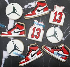 decorated cookies are arranged in the shape of basketball shoes and sneakers with nike's number 13 on them