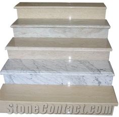 four white marble shelves stacked on top of each other