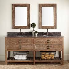 two mirrors are above the double sink vanity in this bathroom with wood flooring and white walls