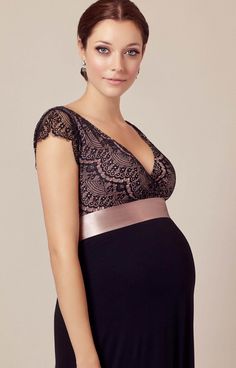 Our best selling Rosa maternity gown in Vintage Blush is the perfect party dress. So we've added a full length version for those A-list evenings when you want to shine. We've increased the opulence and accentuated the drape with an extra layer of sumptuous, soft shimmer sheer black jersey to the skirt. The bodice has a delicate scallop edged lace with a peep of dusky pink sheen. A simple crossover neckline slims and flatters, framed by the daintiest of lace capped sleeves. From a vintage rose de