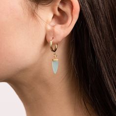 Aqua Chalcedony Pendulum Gemstone Spikes on 15k Gold Filled Huggie style earring - Minimalist, Elegant, Handmade jewelry gifts for her, wife Gemstone: Genuine Aqua Chalcedony Gemstones: 19x5mm approximately Bezel: Vermeil Gold (14k Gold over Sterling Silver) Hoops Material: 14K Gold Filled Hoop Diameter: 13mm Hoop Width: 2mm Closure: FlexCatch Note that due to the handmade nature of these genuine stones, measurements are approximately and might vary slightly for each stone. Arrives in giftbox. M Minimalist Pierced Crystal Earrings Gift, Minimalist Gemstone Hoop Earrings For Gift, Earring Minimalist, Gold Filled Hoops, Aqua Chalcedony, Handmade Jewelry Gift, Sterling Silver Hoops, Silver Hoops, Minimalist Earrings