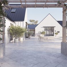 an open courtyard with benches and potted plants