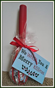 we wish you a merry kissmas candy in a plastic bag with a red candle