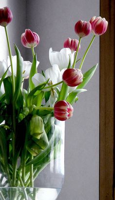 a vase filled with flowers sitting on top of a table