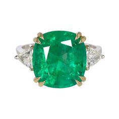 Introducing the epitome of elegance and sophistication: the 6.01ct Natural Emerald. Crafted with unparalleled quality, this emerald has been meticulously certified by the renowned Gemological Institute of America (GIA), guaranteeing its authenticity and superior craftsmanship. Immerse yourself in the captivating allure of its rich green hue, radiating an intense and mesmerizing charm. Prepare to be dazzled by the vibrant sparkle that emanates from every facet of this magnificent gemstone, showca Trillion Diamond Ring, Trillion Diamonds, Cushion Cut Diamond, Diamond Solitaire Ring, Green Cushions, Cushion Cut Diamonds, Fine Jewels, Diamond Solitaire Rings, Green Emerald