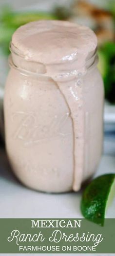 mexican ranch dressing in a mason jar with limes on the side and text overlay