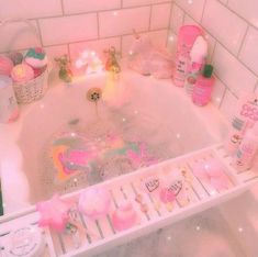 a bath tub filled with lots of pink stuff