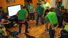 a group of people standing in a living room