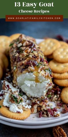 a white plate topped with cheese covered crackers and crackers on top of it