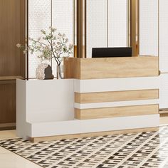 a white reception desk sitting in front of a wooden wall with flowers on the counter