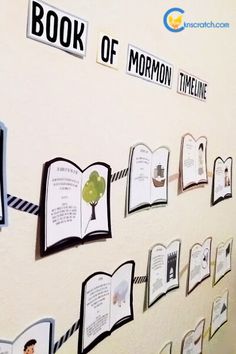 there are many books pinned to the wall with magnets on each bookmark,