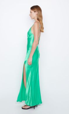 A statement eventwear style, the BEC + BRIDGE Ren Split Maxi Dress is cut on the bias from a lustrous speciality fabric. The dress features a thigh-high split, binding at bust, and fabric rouleau straps that feed through loops and finish at a low-cut, cross-back. This garment is certified Australian Made. Bec Bridge, Split Maxi Dress, Prom Dress Shopping, Under Dress, Brides And Bridesmaids, Thigh High, Low Cut, Long Tops, Wedding Bride