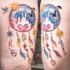 two legs with tattoos on them that have different designs and symbols attached to the thighs