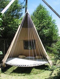 a hammock bed in the middle of a yard