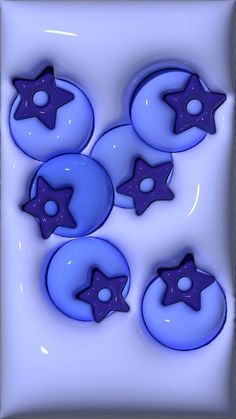 four blue buttons with stars on them