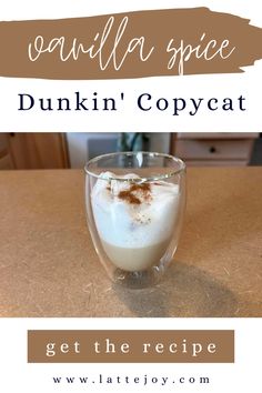 a cup filled with milk and topped with whipped cream