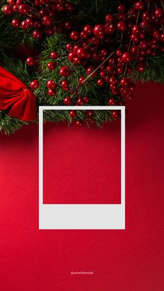 a red background with a white square in the center and some christmas decorations around it