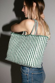 Emerald and white check woven leather tote with tonal woven handles. Tote measures W: 11.75 x D: 5.5" x 9.75" with a 7" Handle Drop. 100% Buffalo Leather. *Buffalo leather develops a beautiful patina by deepening in color over time. It is vulnerable to water stains and tonal changes from the sun. It is recommended to avoid contact with lighter fabrics, as vegetable dyes have the potential to transfer. White Rectangular Bag With Intrecciato Weave, White Woven Leather Tote Shoulder Bag, White Shoulder Bag With Intrecciato Weave For Everyday, White Woven Leather Tote Bag, White Woven Leather Bag For Everyday Use, White Woven Leather Bag For Daily Use, White Intrecciato Weave Shoulder Bag For Everyday Use, White Intrecciato Weave Bag For Travel, Casual White Woven Leather Shoulder Bag