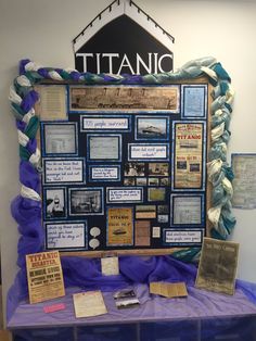 a bulletin board with many different types of information on it and some plaques in front of it