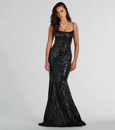 Indulge in luxury and sparkle in the Carly sequin satin formal dress at galas or black-tie soirees! The square neckline and flexible boning create a stunning silhouette, while adjustable spaghetti straps and a lace-up back provide a perfect fit. The flared floor-length hem with a mermaid silhouette adds a touch of elegance, complemented by the intricate sequin scroll pattern on lustrious satin fabric. Style the formal gown with elegant earrings and a clutch for an unforgettable evening look.Fit Glitter Black Prom Dress, Long Black Hoco Dress, Glamorous Satin Gown With Sequins, Glamorous Satin Sequin Gown, Fitted Mermaid Dress With Contrast Sequin For Evening, Sequin Mermaid Dress With Fitted Bodice For Gala, Sequin Satin Gown For Prom Season, Sequin Satin Gown For Prom, Satin Sequin Gown For Prom Season