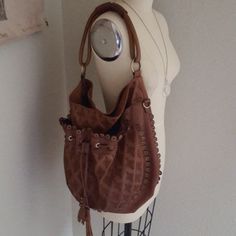 Gorgeous Cognac Leather Hobo Bag With Embroidered Details, Drawstring Tassels & Grommets. Soft & Beautiful. Still Smells Like Leather. Exceptionally Clean In & Out. Some Rub To Leather At Bottom & Handle, But Enhances The Look & Stain At Magnetic Closure Inside, See Pics As Part Of Condition Description. I've Lost Crossbody Strap As Never Used. Beautiful Blue Lining. Made With Such Attention To Detail. Hate To Part & Only Will For Asking. Bag Is Well Worth Asking. Approx Measurements: 15"-18" Ac Luxury Brown Pouch Hobo Bag, Brown Embroidered Hobo Shoulder Bag, Embroidered Brown Hobo Shoulder Bag, Embroidered Brown Hobo Tote Bag, Embroidered Brown Tote Hobo Bag, Embroidered Brown Hobo Bag, Everyday Brown Embroidered Bags, Brown Embroidered Everyday Bags, Brown Everyday Embroidered Bags