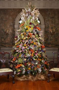 a large christmas tree in the middle of a room