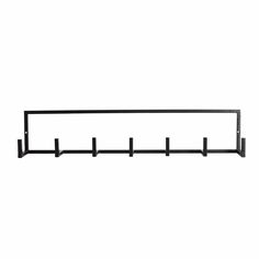 a black metal shelf with four hooks on it