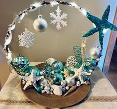 a basket filled with christmas ornaments on top of a table