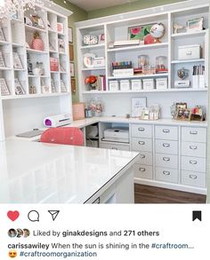 a white kitchen with lots of shelves and drawers