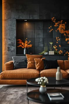 a living room with couches, tables and vases on the coffee table in front of it