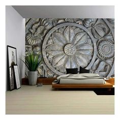 a bedroom with a large wall mural in the middle and a bed next to it