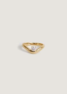 Sleek and modern, the Katherine ring features a round diamond set atop a 14k solid gold curved band. 14k solid gold—always Hollow Band width: 6.5mm (front), 2.5mm (back) Lab Created Diamond Carat weight: 0.26 ctw Diamond Cut: Round Full Diamond Clarity:VS Diamond Color: F/G/H Cut, Polish, Symmetry: Excellent This piece Nameplate Bracelet, Curved Ring, Curve Ring, Round Diamond Setting, Diamond Guide, Right Hand Rings, Anniversary Jewelry, Vs Diamond, Star Jewelry