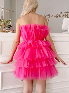 The Too Good To Be Tulle Organza Dress from Sassy Shortcake is a hot pink strapless tiered ruffle dress. She is lined, has a hidden side zipper, and the soft tulle is super comfy - no itch! Also available in baby blue. fits true to size, model wearing a size small Pink Strapless Party Dress With Ruffles, Pink Strapless Dress With Ruffles For Party, Flirty Tiered Strapless Dress With Ruffles, Pink Tiered Strapless Dress For Party, Pink Strapless Ruffled Mini Dress, Pink Strapless Ruffled Dress, Pink Strapless Dress With Ruffles, Pink Strapless Ruffled Dress For Spring, Summer Ruffled Tulle Strapless Dress