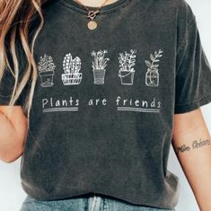 Brand New, In Plastic, Never Been Opened Plants Are Friends T-Shirt. It Has Never Been Tried On, But It Should Fit Like A Medium. Product Picture Shows Grey Shirt On Model, But This Shirt Is Dark Red. Trendy Crew Neck Tops With Plants Print, Trendy Crew Neck Shirt With Plant Print, Casual Short Sleeve Tops With Plant Print, Casual Shirt With Plant Print, Casual Crew Neck Top With Plants Print, Casual Everyday Tops With Plant Print, Trendy Cotton Tops With Plant Print, Casual Tops With Plant Print For Everyday, Everyday Crew Neck Top With Plant Print