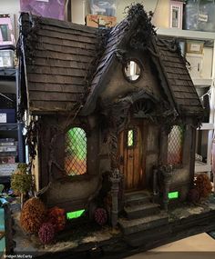 a doll house made to look like it is in the shape of a fairy's house