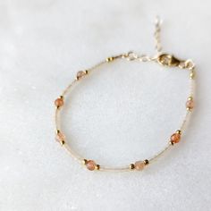 The perfect sun-kissed combination of semi-transparent extra light peach glass beads and Sunstone. This bracelet is neutral, yet warm and inviting. It is the perfect trending color and is inspired by the warm coral colors of the coast. SHOP THE MATCHING NECKLACE! Sunstone is associated with the Sun's radiant energy. This is a stone that enhances your personal power and instills your life with joy, courage and optimism. This is a stone that you want close to you at all times. Colors: This beaded Coral Colors, Light Peach Color, Oregon Sunstone, Radiant Energy, Personal Power, Light Peach, Peach Color, Gold Accent, Semi Transparent