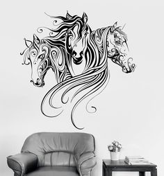 a black and white horse wall decal with swirly manes on it's face