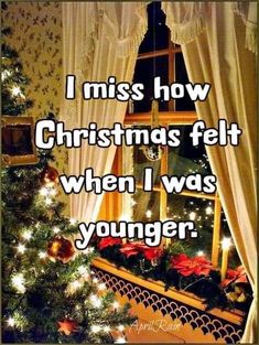 a christmas tree in front of a window with the words i miss how christmas felt when i was younger