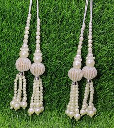 Indian Handmade White Pearl Latkan for Saree Blouse Lehenga HandBags Dupatta Decoration Bridal Wedding dress for Women pair of 2 pcs Size - 17.0 cm Length  Item Description You can use this Beautiful pair of tassle for several DIY projects.  *These beautiful Tassel Latkans are used as the accessory for saree blouse on the back, but u can use according to your need and your innovative ideas. * Package contains 2 Latkan / 1 Pair Other Than Saree Blouse, you can use these latkans in various ways Craft Projects Designing Home Decoration Festive celebrations. Evening and party Apparels. Home décor items Apparel & Fashion Scarves n Stoles Headband, hats Table cover, curtains, Pillow covers, Cushion cover Shoe designing Headband, hats Table cover, curtains Designing stylish blouses Ship From New Elegant White Sets For Puja, Festive White Sets With Latkans, White Wedding Sets With Latkans, Saree Bluse, Wedding Dress For Women, Sari Lehenga, Blouse Lehenga, Bridal Wedding Dress, Innovative Ideas