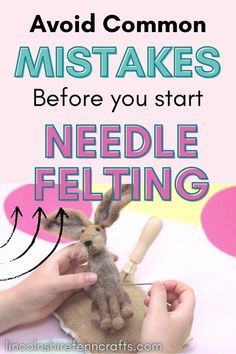 someone is holding a needle felt bunny in their hand and pointing it at the needle